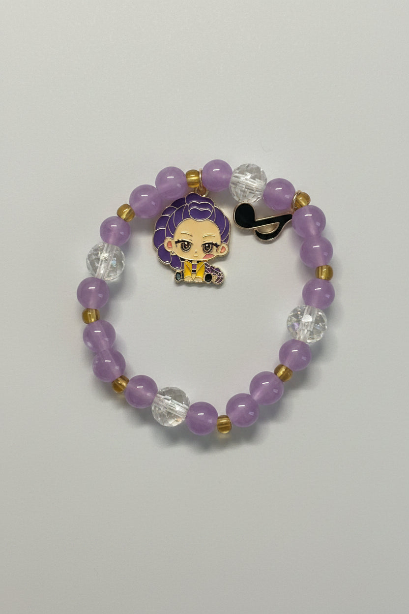 Purple beaded bracelet with a character charm in a clear display case.